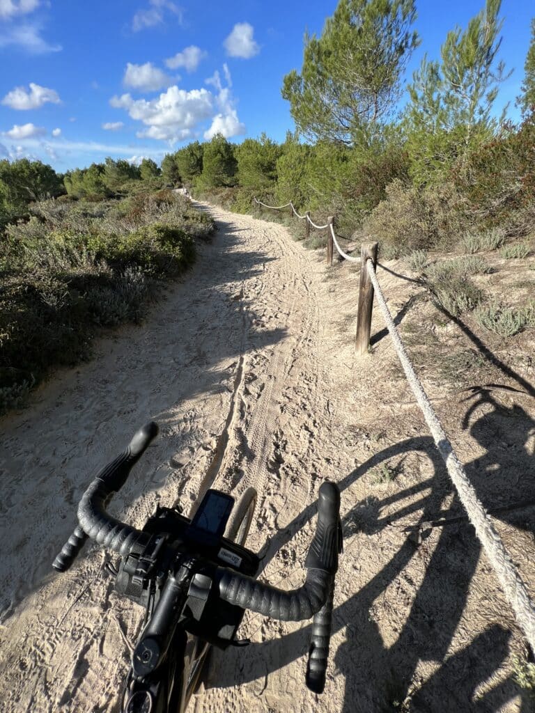 Riding gravel bike in sand